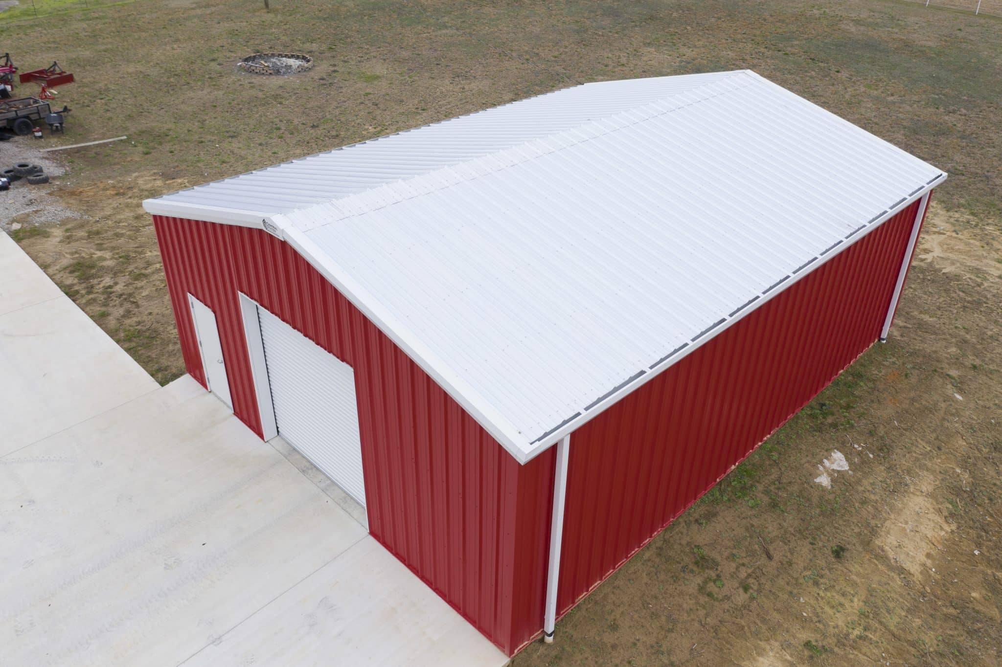 Centra Series Galvalume Roof and Crimson Red Siding with one garage bay door