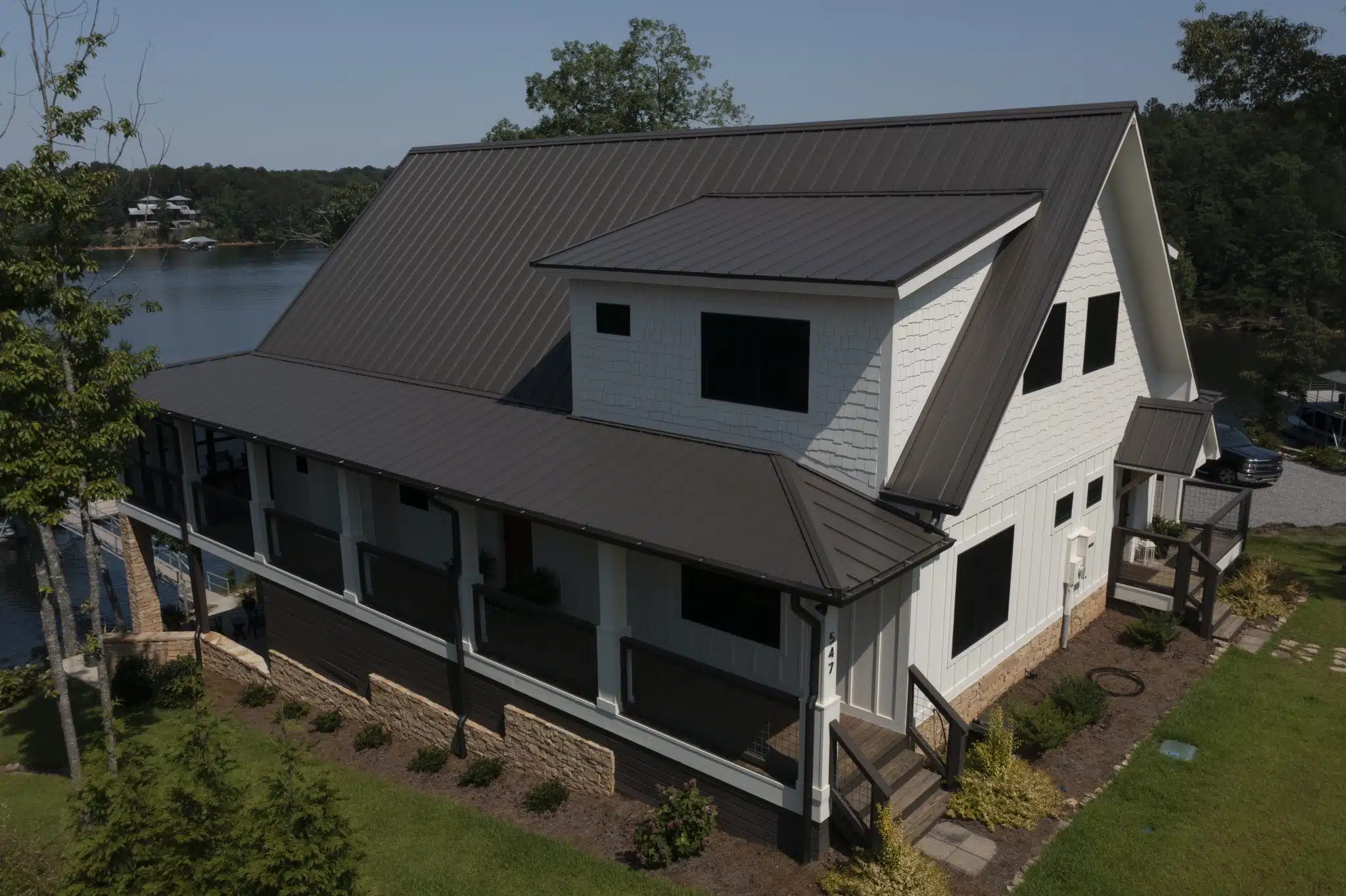 Board and Batten white siding and burnished slate horizon-loc roofing
