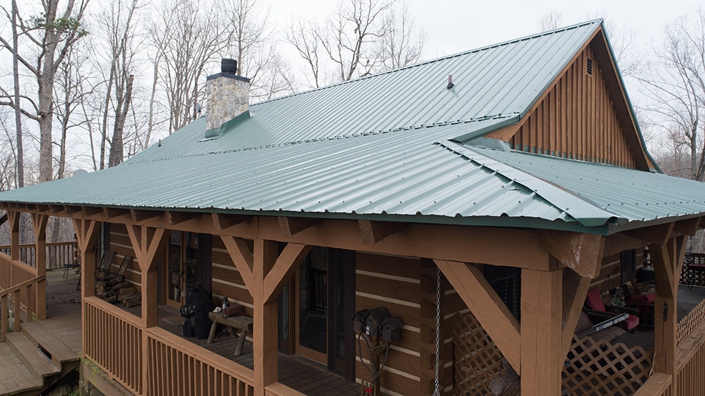 Cabin with Steel Roof in Hunter Green and Wood Siding