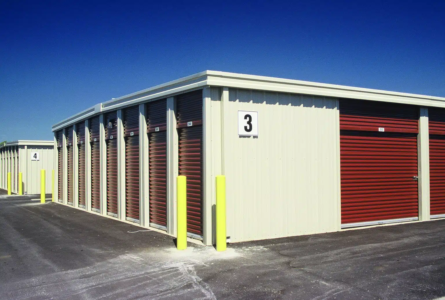 Self Storage Buildings White Walls with Red Doors