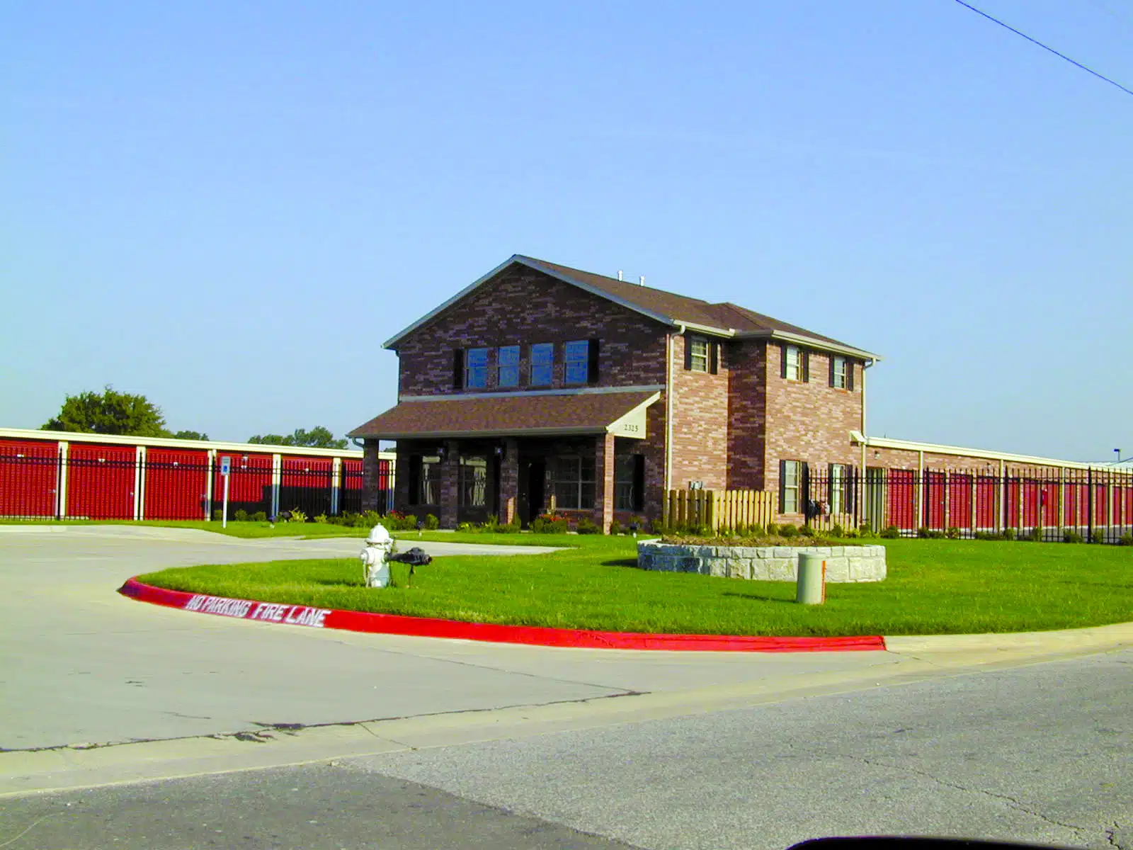 Self Storage Buildings with Red Doors and Storefront