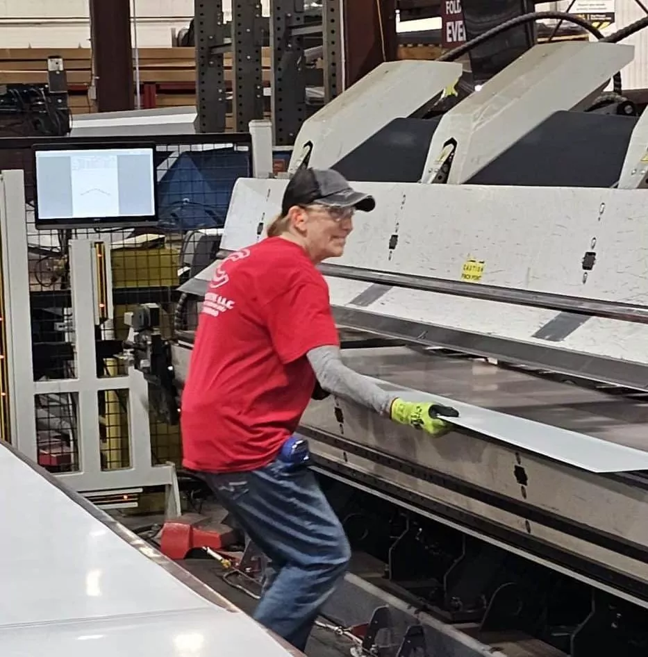 Female Employee working at a trim bending machine