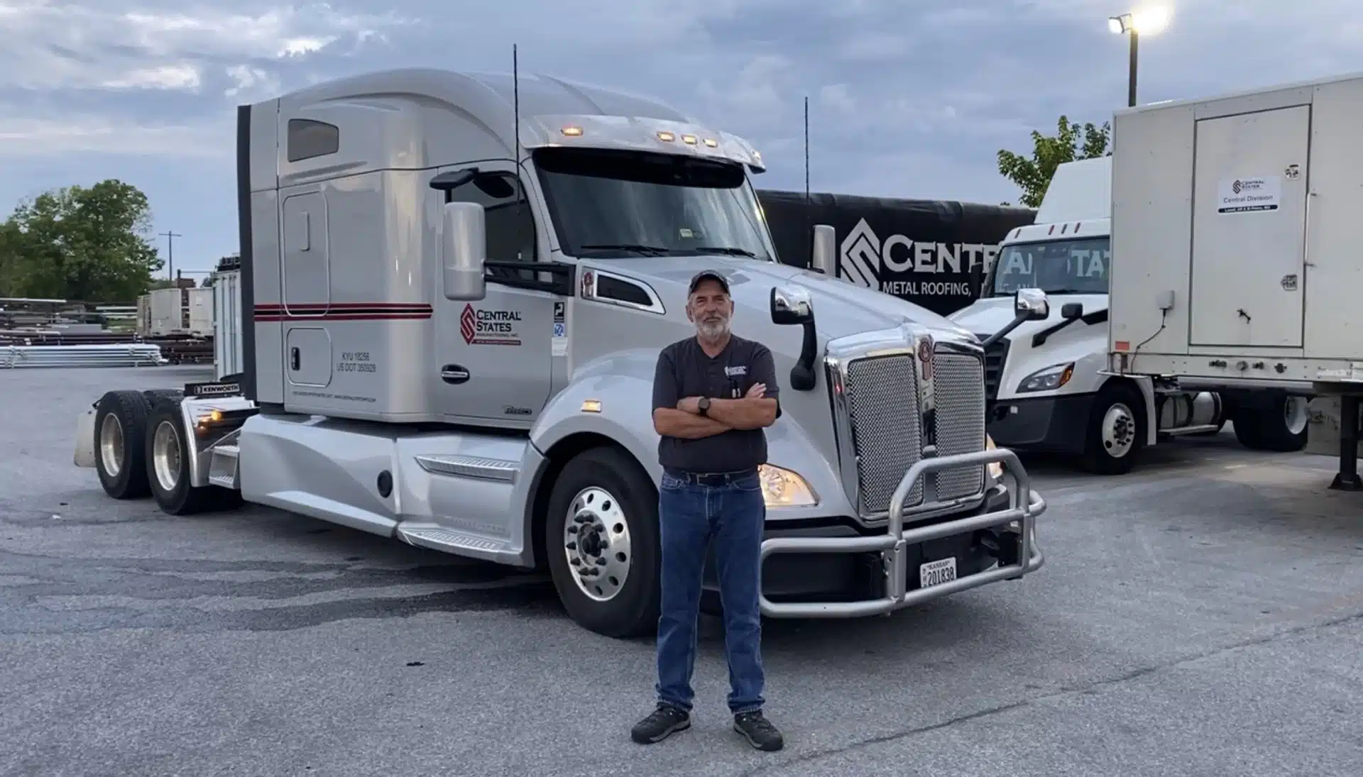 a driver for Central States stands proud in front of his truck