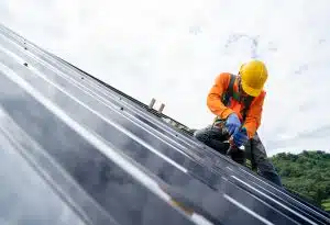 Man installing a metal roof