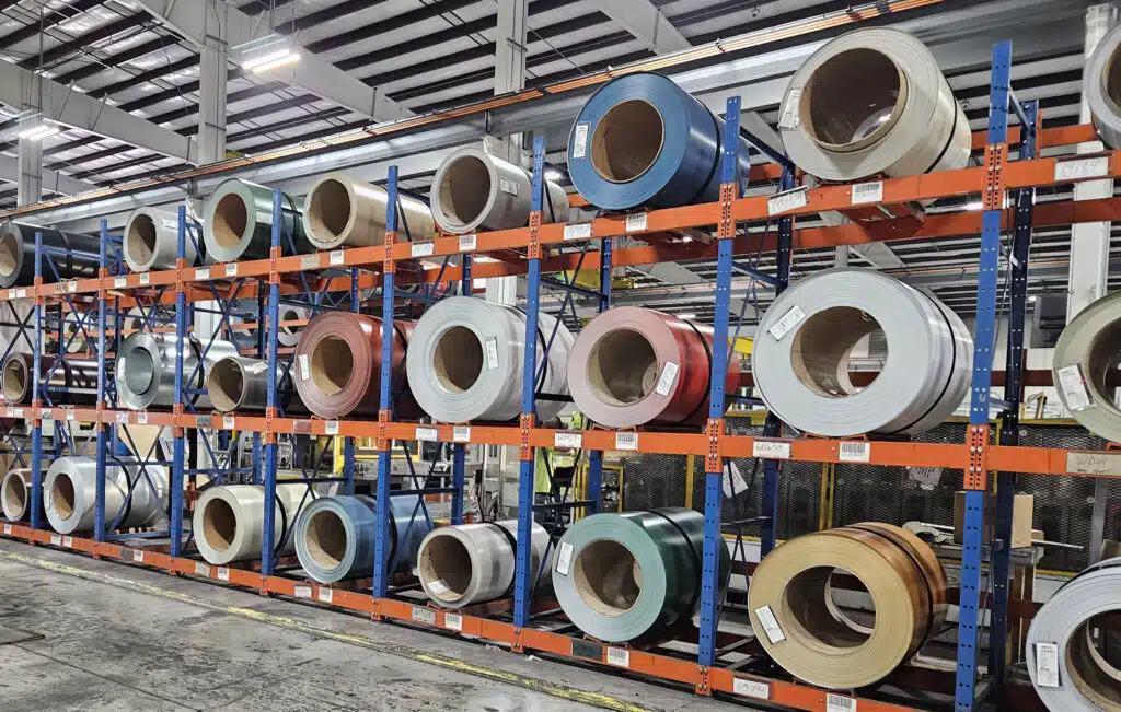 Metal Coil rolls in racks at a manufacturing facility